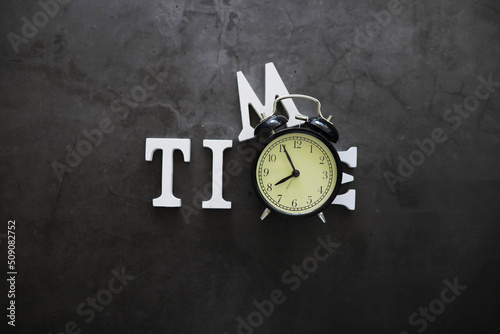 Wallpaper Mural Big alarm clock. The clock is on the table. The inscription "time". Time for rest and travel. Torontodigital.ca