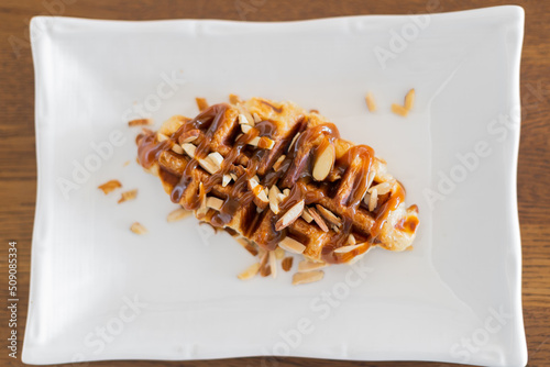 Caramel croffle and sprinkled with almonds
