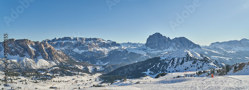 Beautiful Winter Landscape in the Val Gardena. Sassolungo Mountain in the background. Wide Winter Landscape © Rabanser