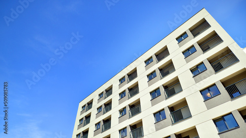 Apartment residential house and home facade architecture and outdoor facilities. Blue sky on the background. Sunlight in sunrise.