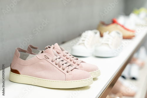 Close-up of fashionable pink women's sneakers in a shoe store