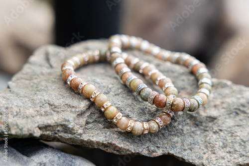 Two bracelets made of natural jasper stones beads. Handmade jewelry. Woman exoteric accessories. Talismans and amulets.