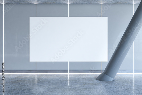 Print op canvas Front view on big blank white banner with space for your logo or text on grey wall in empty sunlit business center hall with tilted column and glossy floor
