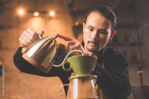 Asian hipster barista worki...