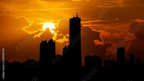 Seoul Yeoeuido financial district skyscrapers at Sunset, Time Lapse with Red Sky and Fiery Sun, South Korea photo