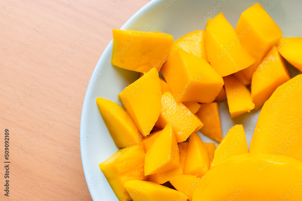 Diced fresh mango fruit on plate
