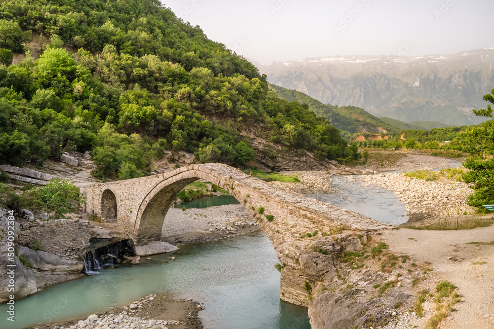 Old arch shape stone bridge and Benja Thermal Baths in Permet, Albania