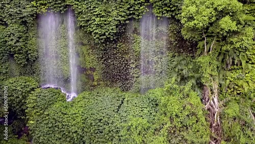 We got lost in the jungle, Primeval forest.
Amazing aerial view flight pull out drone footage
Waterfall Benang Kelambu Lombok Indonesia 2017. Cinematic view from above Tourist Guide by Philipp Marnitz photo