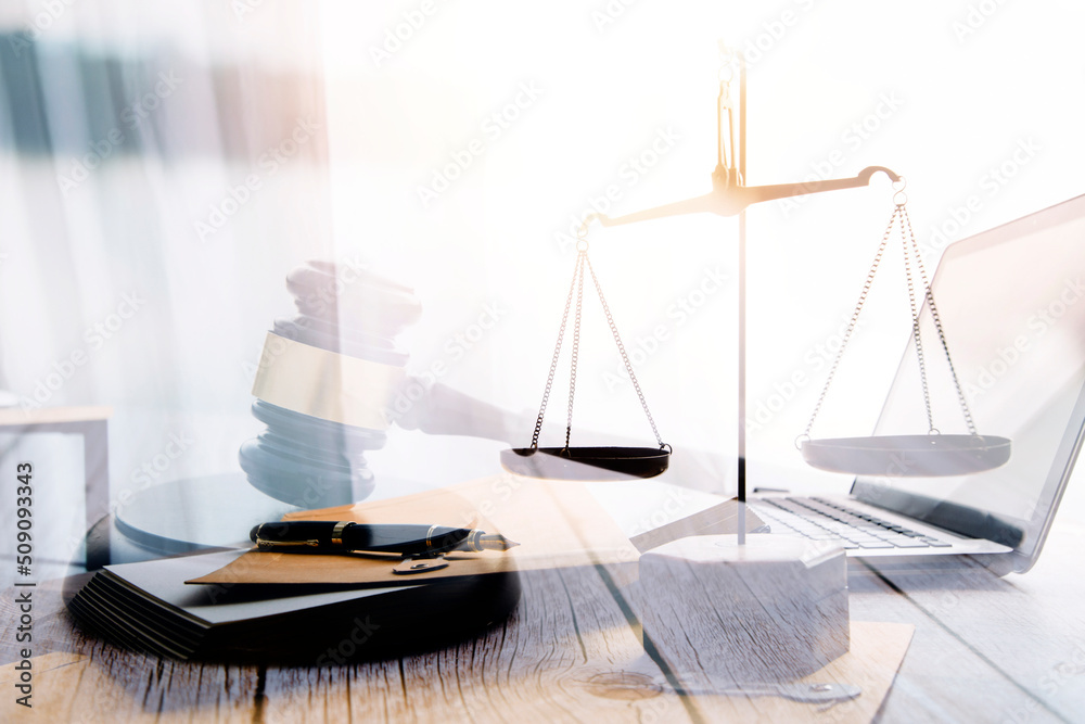 justice and law concept.Male judge in a courtroom on wooden table and Counselor or Male lawyer working in office. Legal law, advice and justice concept. justice and law concept.Male judge in a courtroom on wooden table and Counselor or Male lawyer working in office. Legal law, advice and justice concept.
