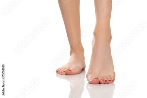 beautifully cared female feet on a white background © vladimirfloyd
