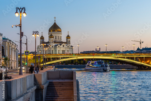 Sunset view of the Cathedral of Christ the Savior and the Moskva River in Moscow, Russia. Architecture and sights of Moscow. Moscow postcard.