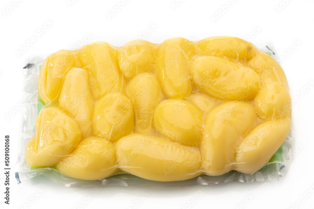 Potatoes in vacuum packed sealed for sous vide cooking isolated on white background Potatoes in vacuum packed sealed for sous vide cooking isolated on white background
