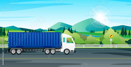 Cargo trucks are running on the highway with traffic signs.