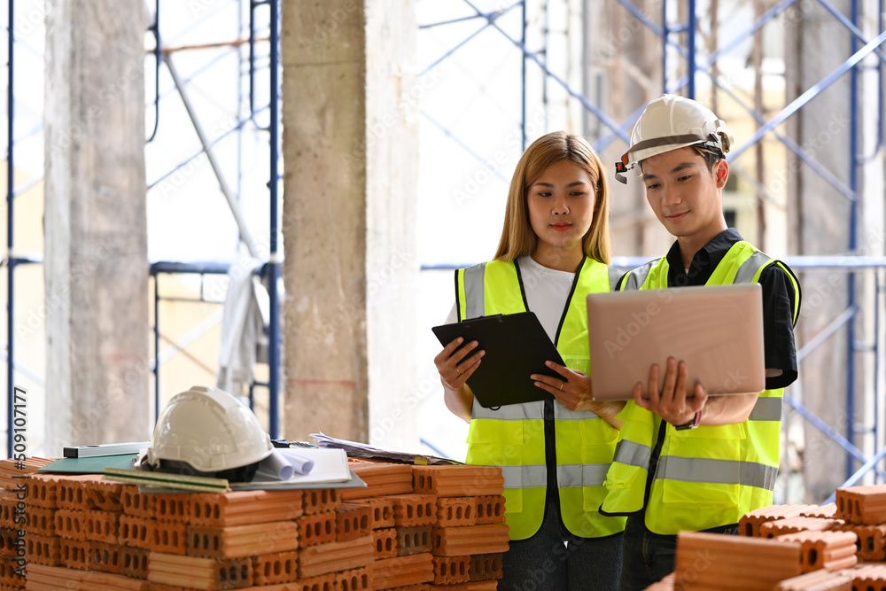 Architect team using modern devices and discussing, planning