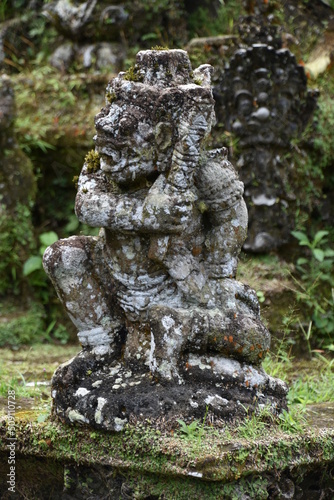 Monkey God Statue on Mossy Buddhist Altar Portrait, Gunung Kawi Temple, Bali © Globepouncing