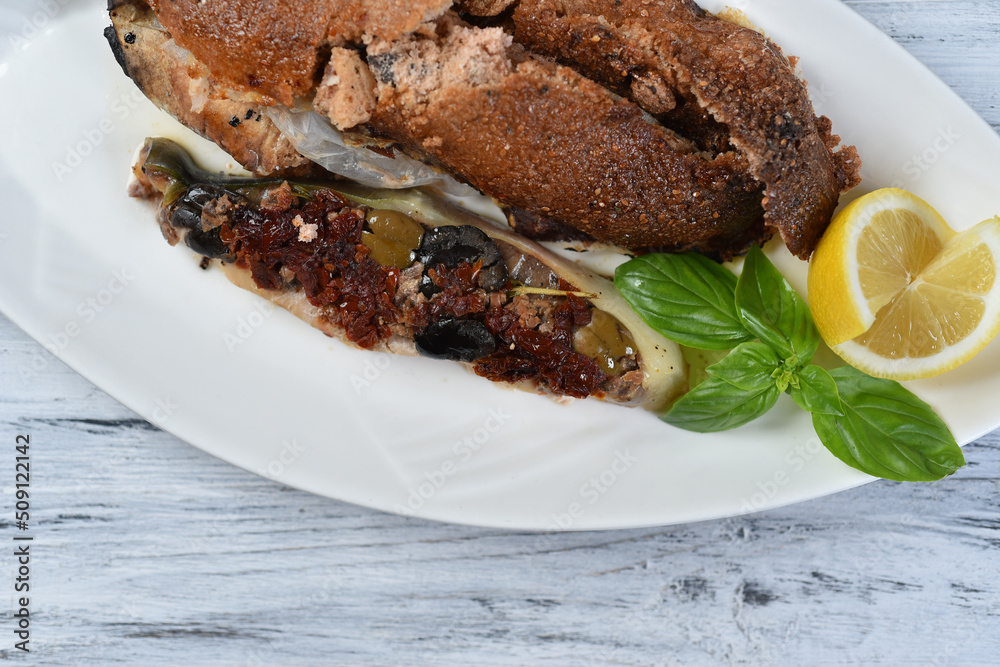 grilled fish with sun-dried tomatoes and olives
grilled fish with sun-dried tomatoes and olives