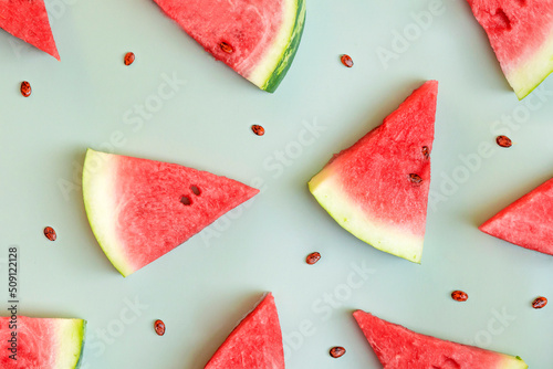 Watermelon pattern. Red watermelon on green background. Summer concept. Top view, close up