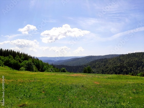 Mountain Ozren and Zvijezda landscape with sky, grass and trees, Bosnia and Herzegovina photo