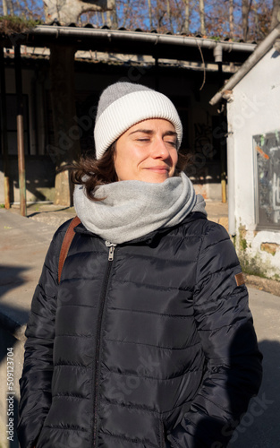 young happy woman with eyes close and smiling