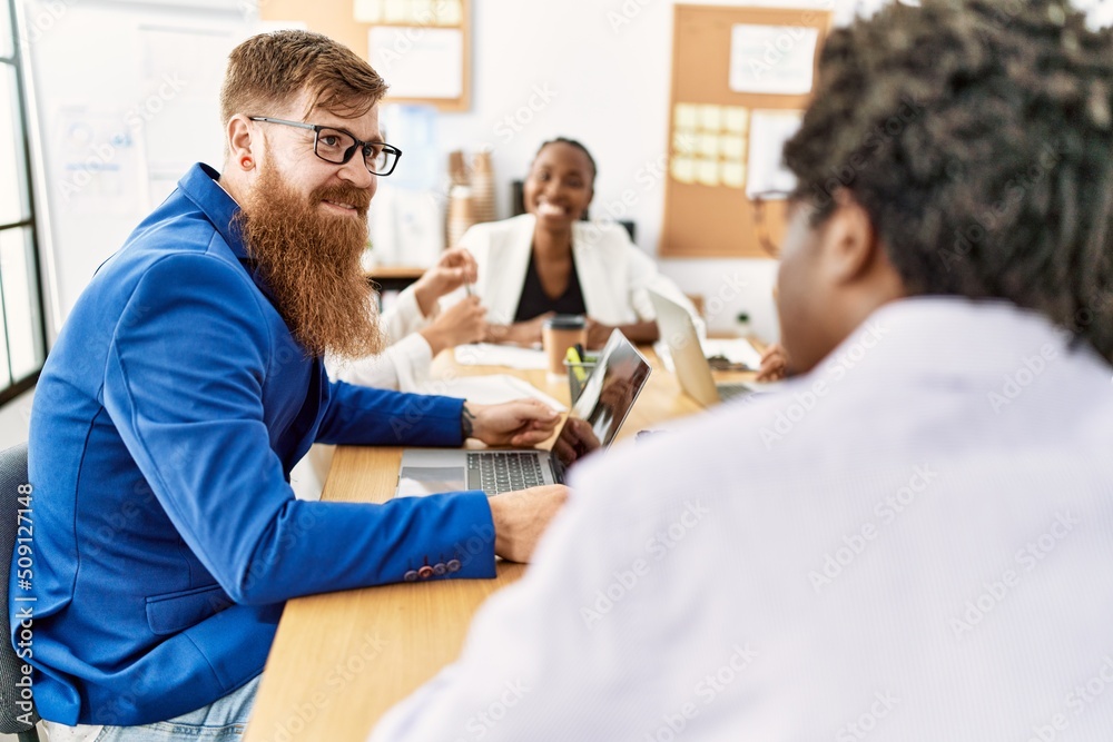 Fototapeta premium Group of business workers smiling happy working at the office.