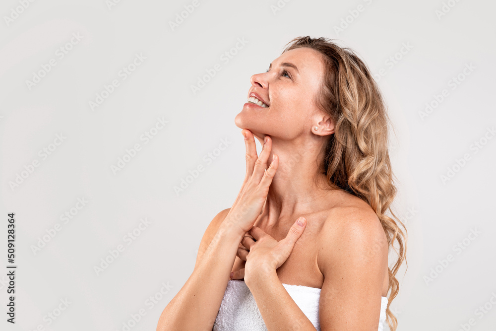 Double Chin Treatment. Beautiful Middle Aged Woman Touching Smooth Skin On Neck - obrazy, fototapety, plakaty 