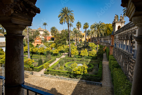 Beautiful formal public garden inside Alcazar Seville palace in summertime in Andalusia © Irina Schmidt