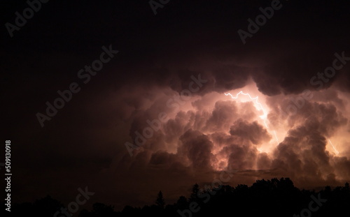 Lightning in the sky during a storm at night