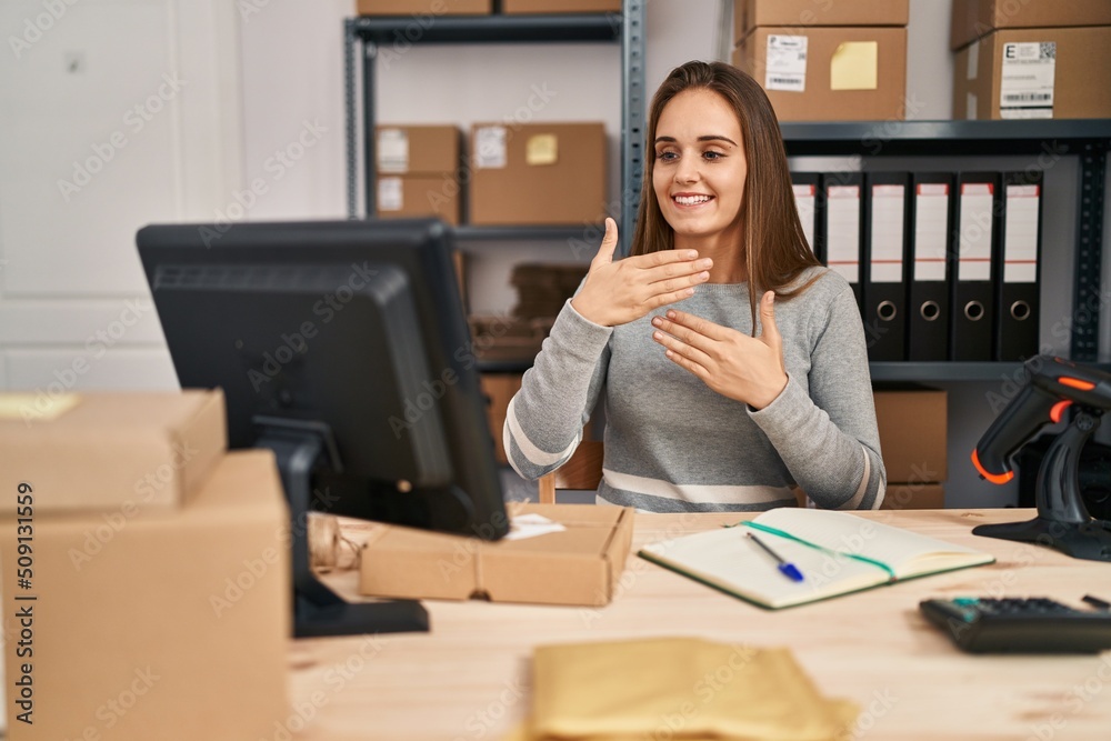Young blonde woman ecommerce business worker having online deaf language conversation at office Young blonde woman ecommerce business worker having online deaf language conversation at office