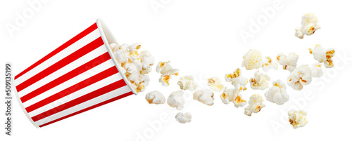 Delicious popcorn flying from paper bucket, isolated on white background