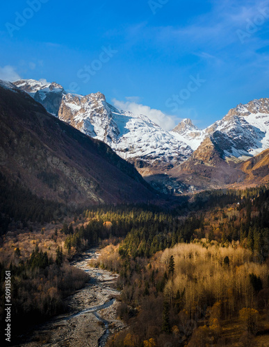 autumn weather in a mountain gorge against a blue beautiful sky