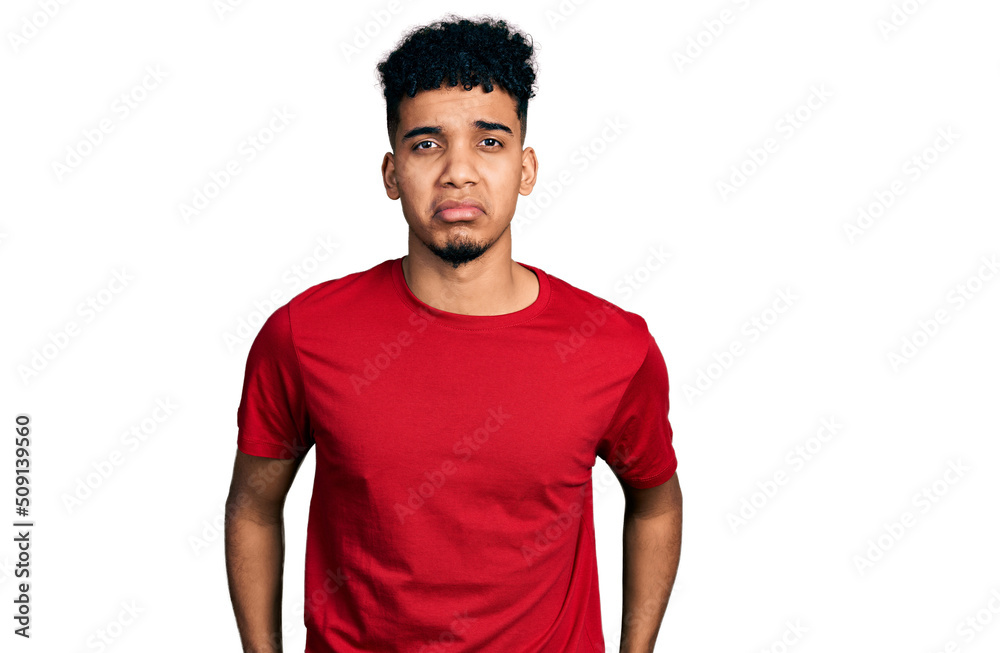 Young african american man wearing casual red t shirt depressed and worry for distress, crying angry and afraid. sad expression. Young african american man wearing casual red t shirt depressed and worry for distress, crying angry and afraid. sad expression.