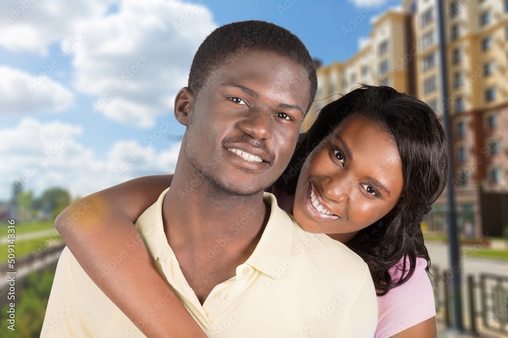 Couple In Love. Portrait of joyful woman hugging her boyfriend, standing together Couple In Love. Portrait of joyful woman hugging her boyfriend, standing together