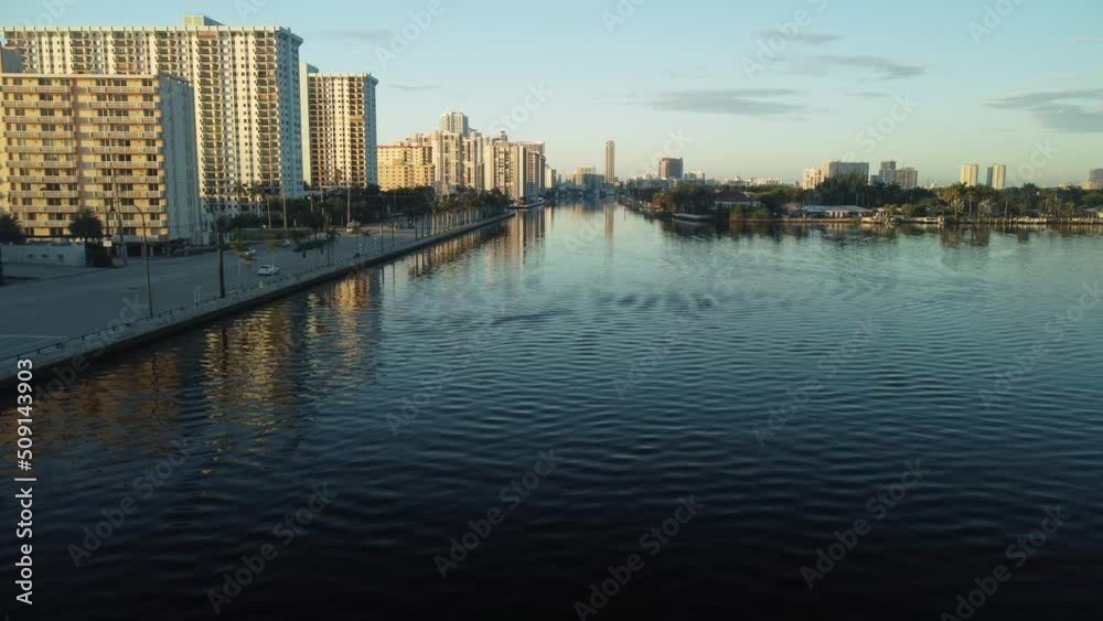 Aerial view of the skyline as the sun is rising. We are flying over the Intracoastal Waterway with a view of oceanfront condos and hotels Aerial view of the skyline as the sun is rising. We are flying over the Intracoastal Waterway with a view of oceanfront condos and hotels