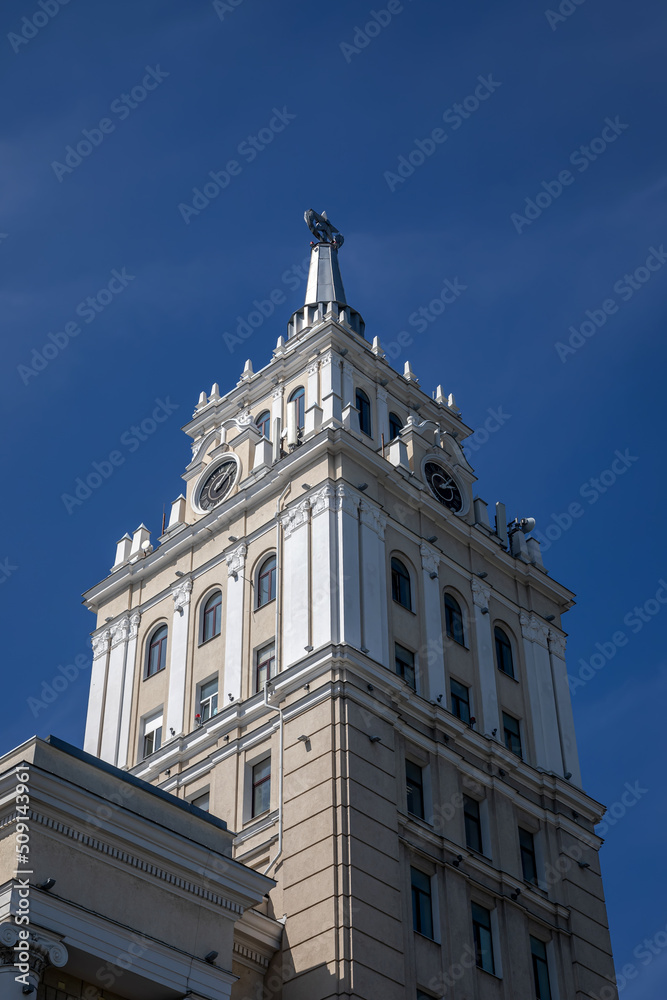 The beautiful building is rising in height. Sunny day. Ancient architecture. The beauty of city buildings.