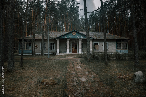 An old building in an abandoned pioneer camp. Emblem of the USSR. Beautiful nature. Ancient architecture. Mystical abandoned building. © Kooper