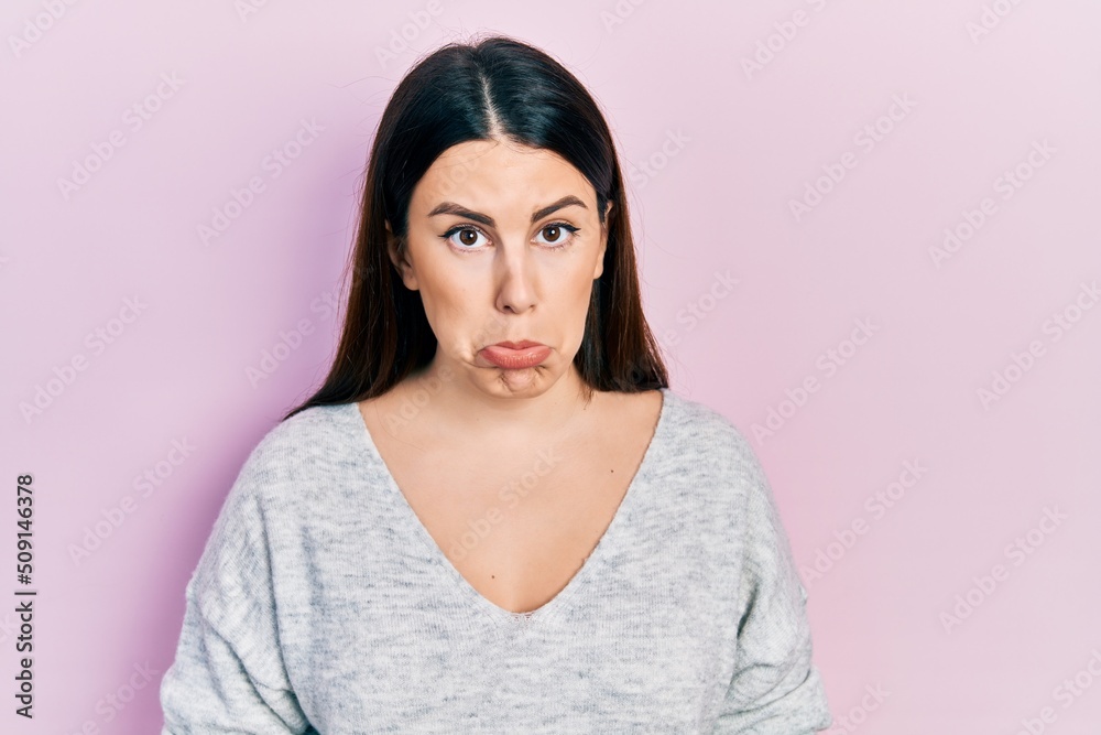 Young hispanic woman wearing casual clothes depressed and worry for distress, crying angry and afraid. sad expression. Young hispanic woman wearing casual clothes depressed and worry for distress, crying angry and afraid. sad expression.
