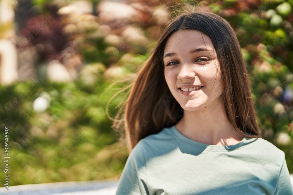 Adorable girl smiling confident looking to the camera at park Adorable girl smiling confident looking to the camera at park