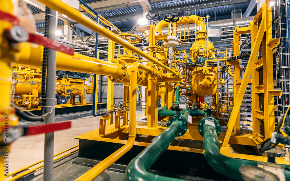 Pressure meters on natural gas yellow pipeline red valves. Concept industry power plant background Pressure meters on natural gas yellow pipeline red valves. Concept industry power plant background