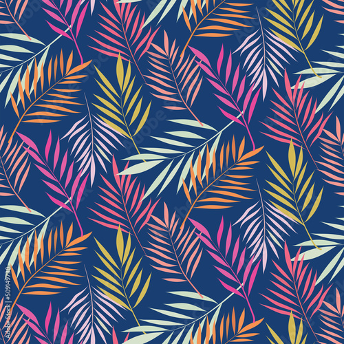 Fototapeta Naklejka Na Ścianę i Meble -  Beautiful tropical palm  leaves seamless pattern in pink, red, coral, yellow and off white on navy blue background. For summer backgrounds, fabric, textile and home décor 