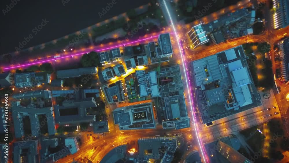 Top down hyper lapse footage of traffic in urban borough at night. Visual effect highlighting traces of vehicles. Frankfurt am Main, Germany