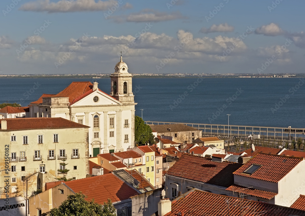 Graca neighborhood and Sao Estevaoe chruch, with Tagus river in the bacckground, Lisbon, Portugal