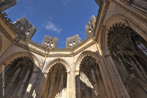 carved arches, pillard and vaults in Interior of the Unfinished chapels in Batalha monastery, Portugal photo