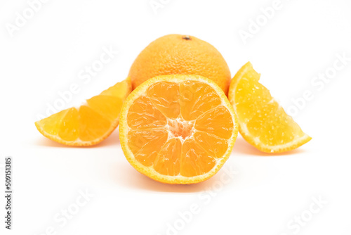 selective focus Tangerine or komola in a plate isolated on white background,