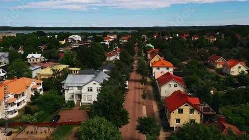 Aerial view of colorful neighborhood streets of Mariehamn city,  summer in Aland, Finland - reverse, drone shot photo