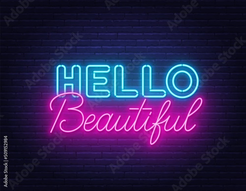 Hello Beautiful neon lettering on brick wall background.