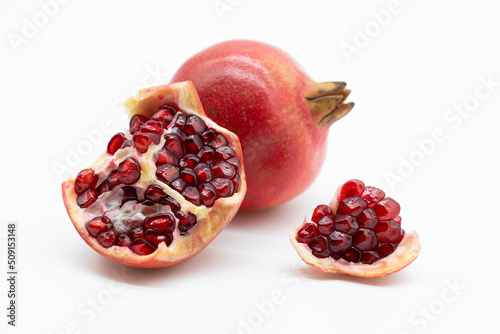 Fresh Pomegranate and seeds isolated on white background With clipping path.