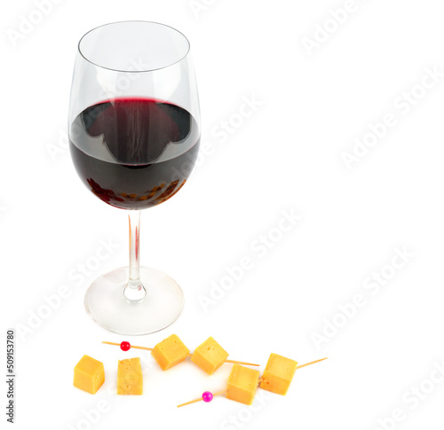 Glass of red wine and pieces of cheese isolated on white . Place for your text. photo