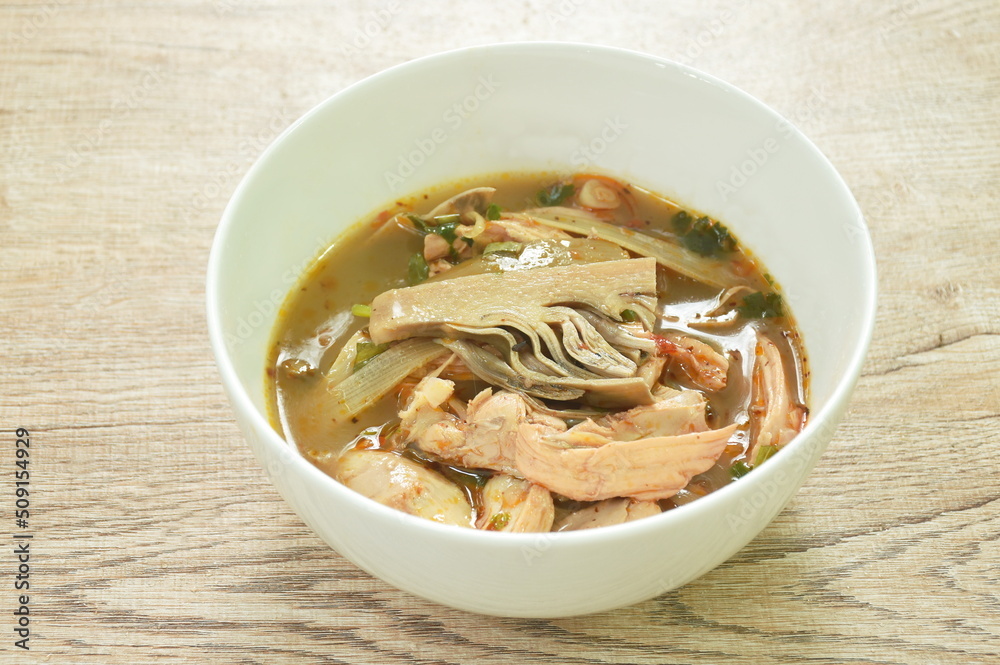 spicy boiled chicken meat with ripe banana blossom soup on bowl spicy boiled chicken meat with ripe banana blossom soup on bowl