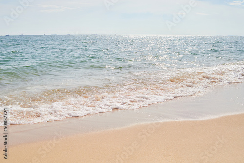 Sand and beach with frothy wave 
