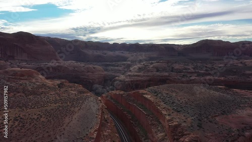 Aerial shot of railway track in between the canyon mountain of moab Utah.  photo